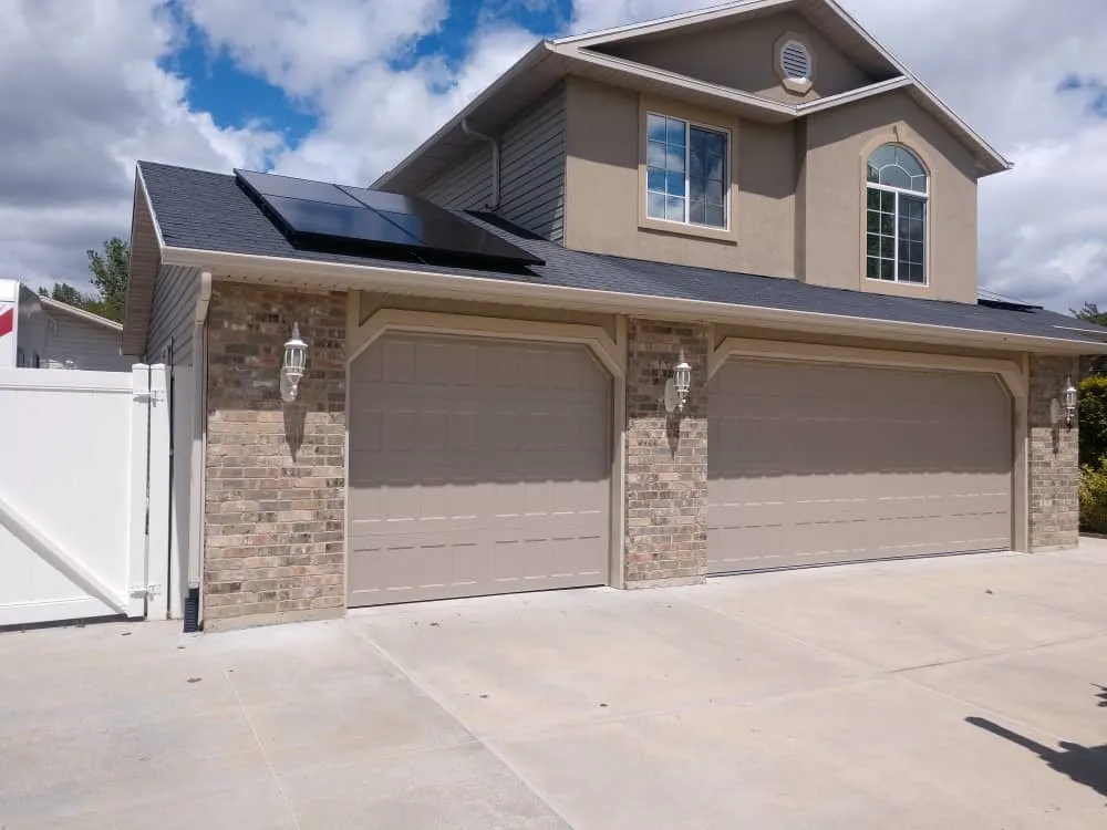 Insulated steel garage door style on residential Utah home