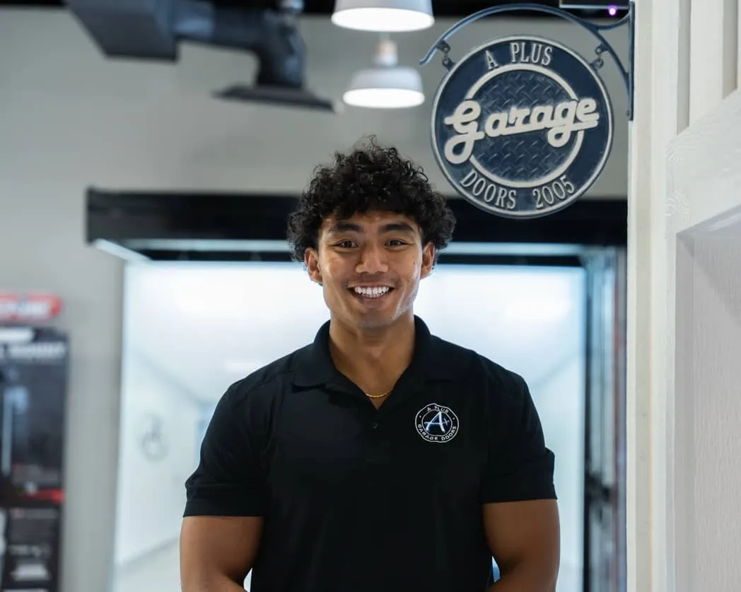 A Plus Garage Doors team member standing in the showroom