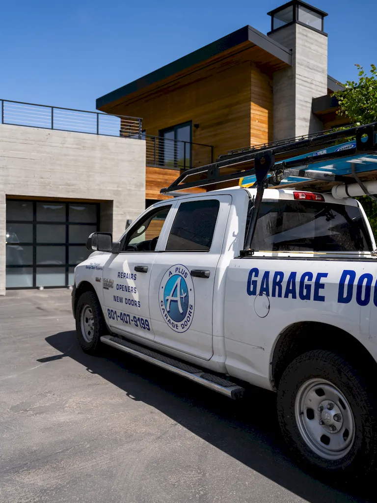 Homeowner standing near a garage door in a driveway