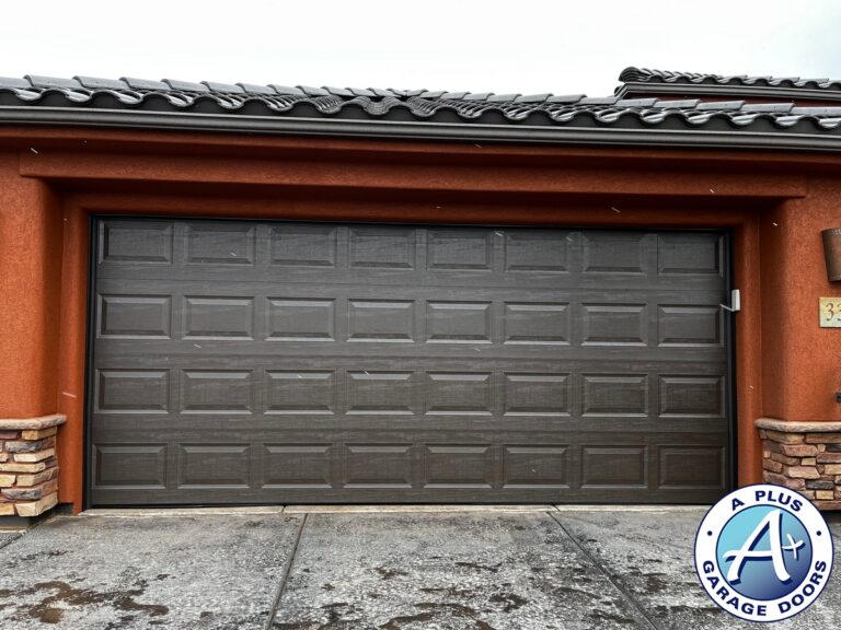 Dark brown insulated Amarr garage door installation in Ivins, Utah