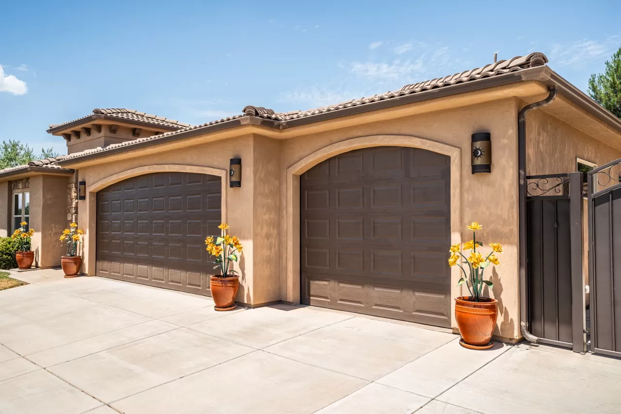 Spanish Style House with Brown Garage Doors - Double & Single | A Plus Garage Doors | St George Services | Garage Door Installation Near Me | A+ Garage Door Repair St George, Utah