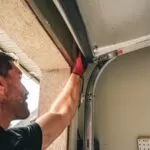 Garage Door Technician Manually Closing Garage Door | Garage Door Won't Close | Garage Door Stuck Open | Garage Door Not Closing | A Plus Garage Doors